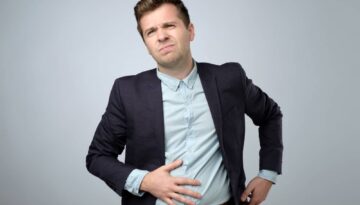 European,Young,Man,In,Suit,Having,Stomach,Pain.,Colic,Or
