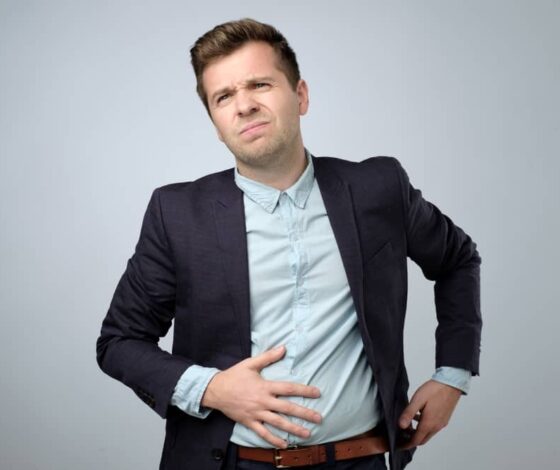 European,Young,Man,In,Suit,Having,Stomach,Pain.,Colic,Or